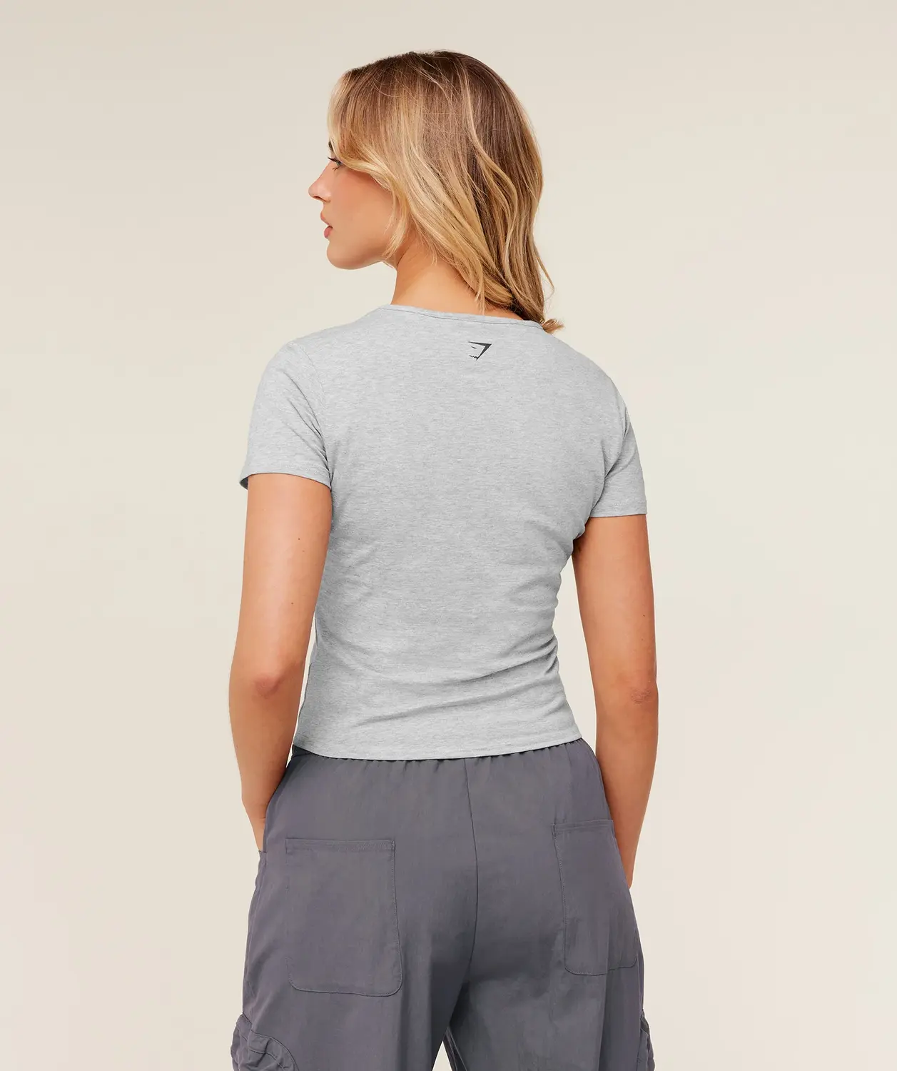 Worn Crest Graphic Baby Tee - Image 2