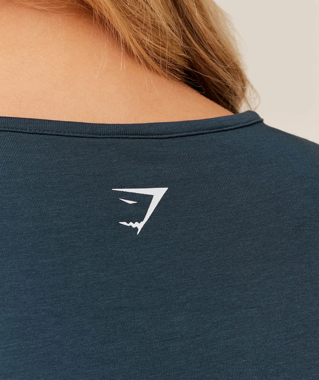 Worn Crest Graphic Baby Tee - Image 5